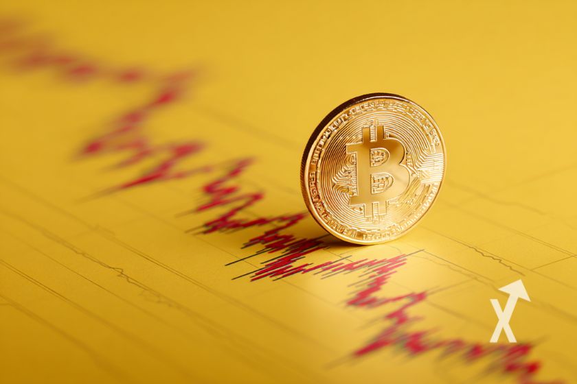 bitcoin coin 3D sur une feuille jaune avec une trenline en rouge