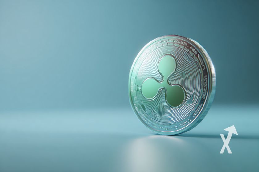 coin XRP en bleu sur un fond bleu/vert avec de la lumière