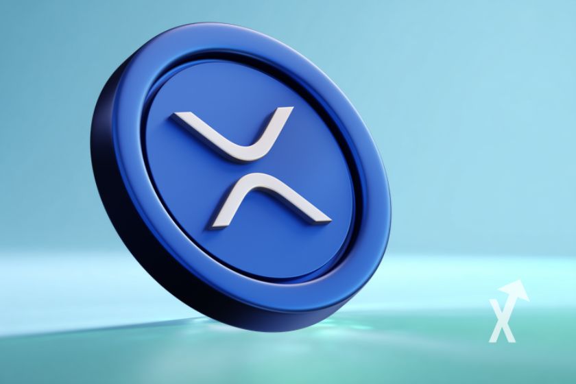 coin XRP en bleu sur un fond smble bleu ciel