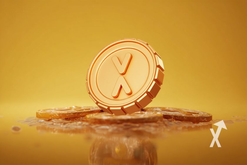 coin XRP jaune sur un fond jaune et posé sur des tokens au sol