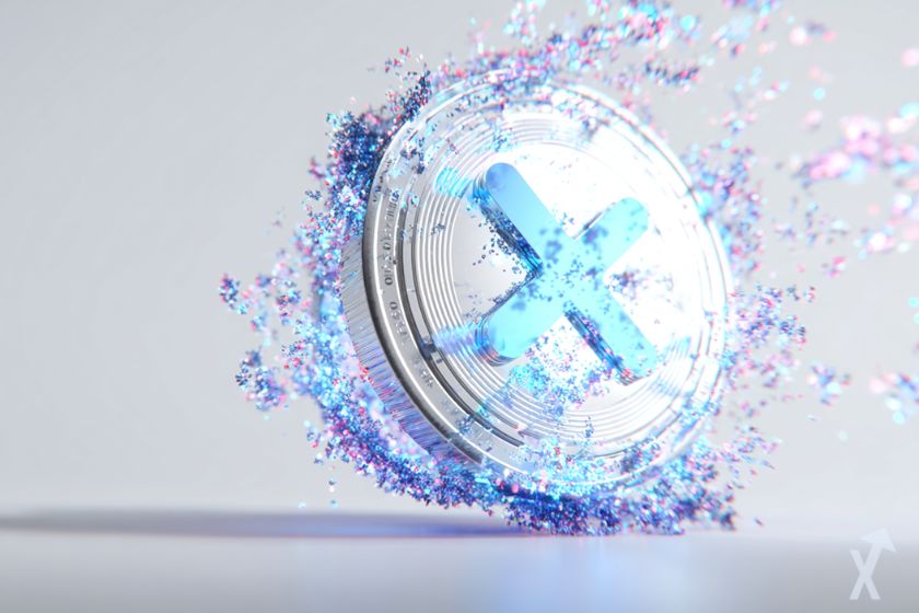 coin 3D xrp blanc et bleu avec une explosion de couleurs bleu autour sur fond gris