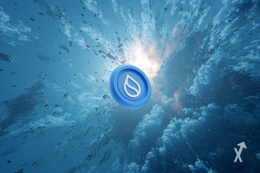 Le token Sui sur un fond bleu dans une explosion de fumée