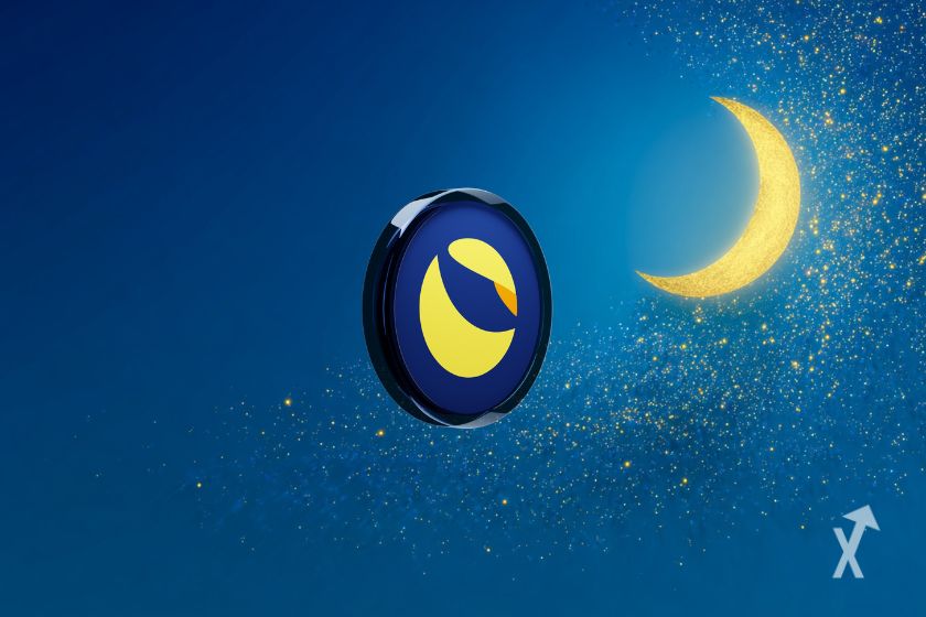 Le token de LUNC devant un ciel bleu foncé avec des étoiles et une demi-lune en haut à gauche