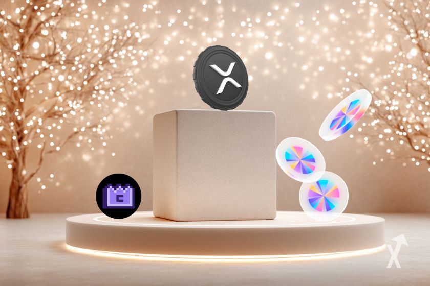 Des cryptomonnaies posées sur un podium sur un fond blanc avec des arbres de Noël