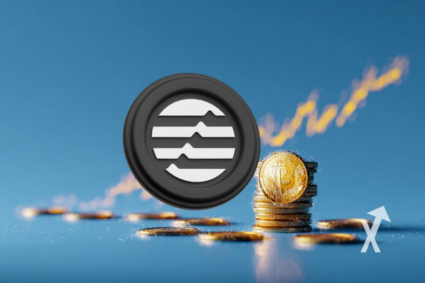 coin aptos sur un fond bleu avec trendline aune qui monte et des coins empilés