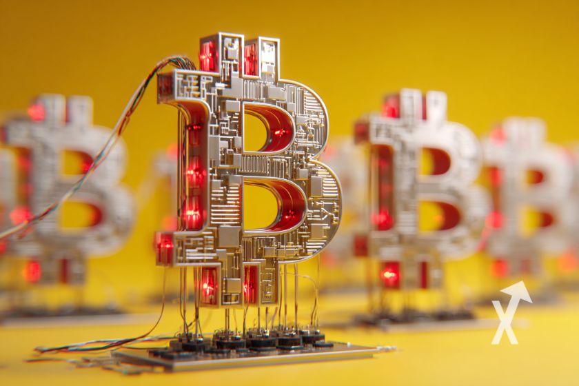 Bitcoin logo branchés à des machines sur un fond jaune