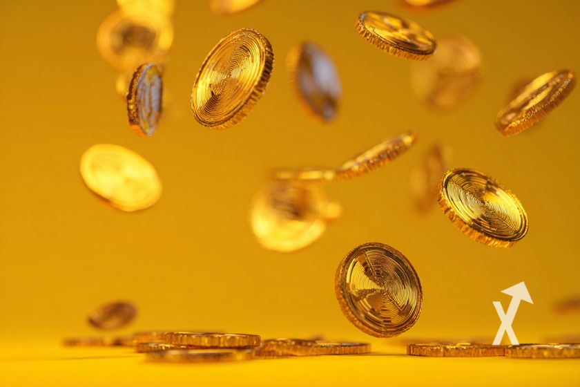 crypto tokens jaunes sur un fond orange