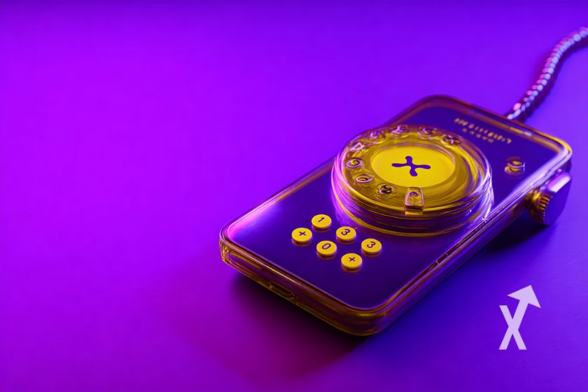 telephone avec coin XRP dedans sur un fond violet