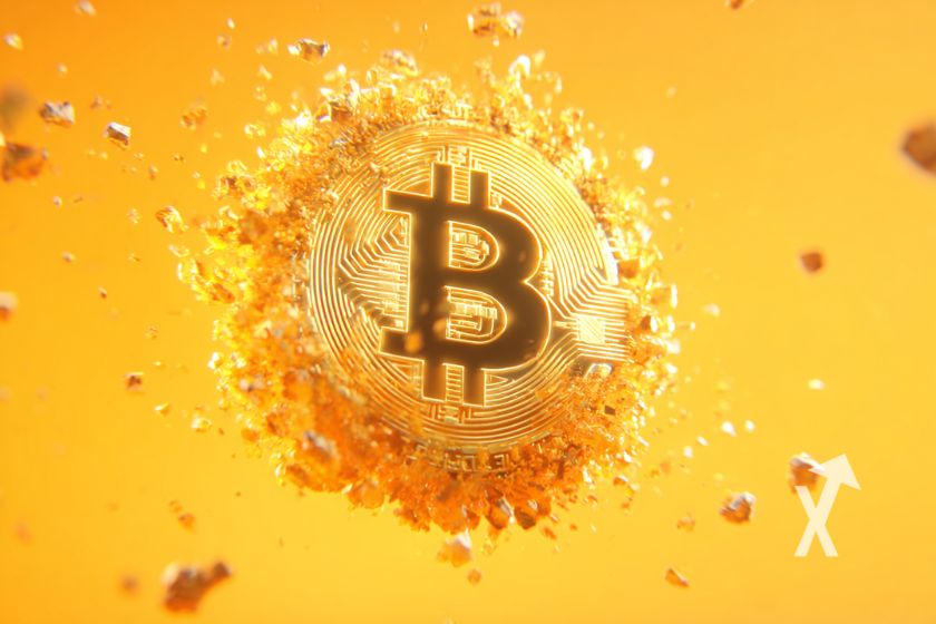 Bitcoin coin dans une explosion sur un fond orange