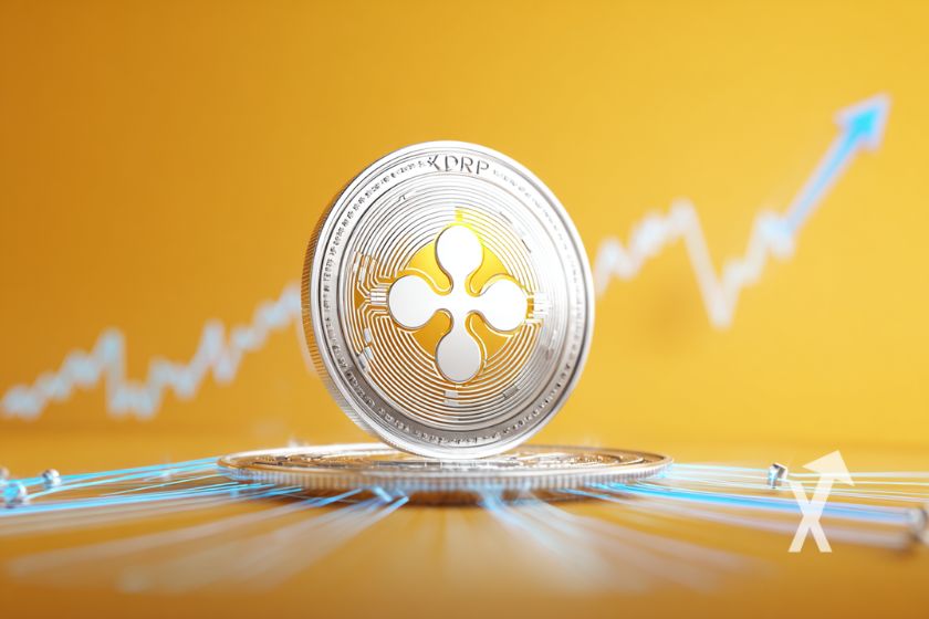coin XRP sur un fond jaune avec trendline bleue