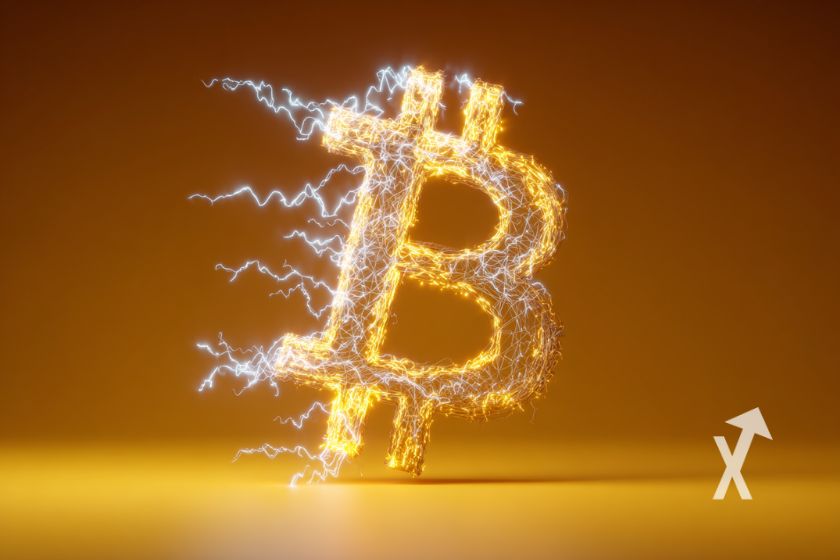 Logo Bitcoin amarillo brillante en sombra.