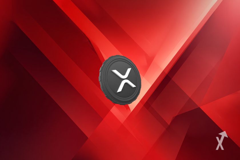 Token XRP gris sobre fondo rojo (Gray XRP token on red background)
