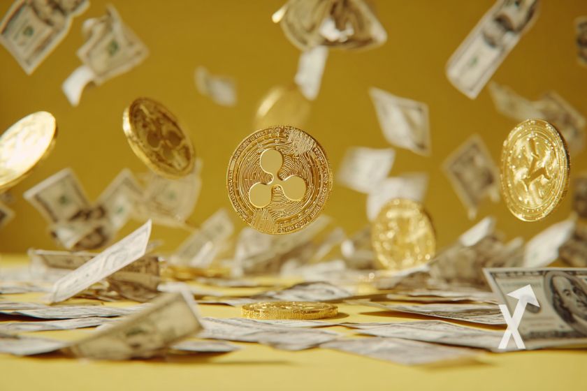 Moneda XRP amarilla con d&oacute;lares volando.