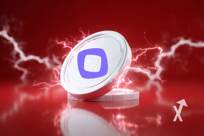 Moneda blanca con electricidad en rojo.