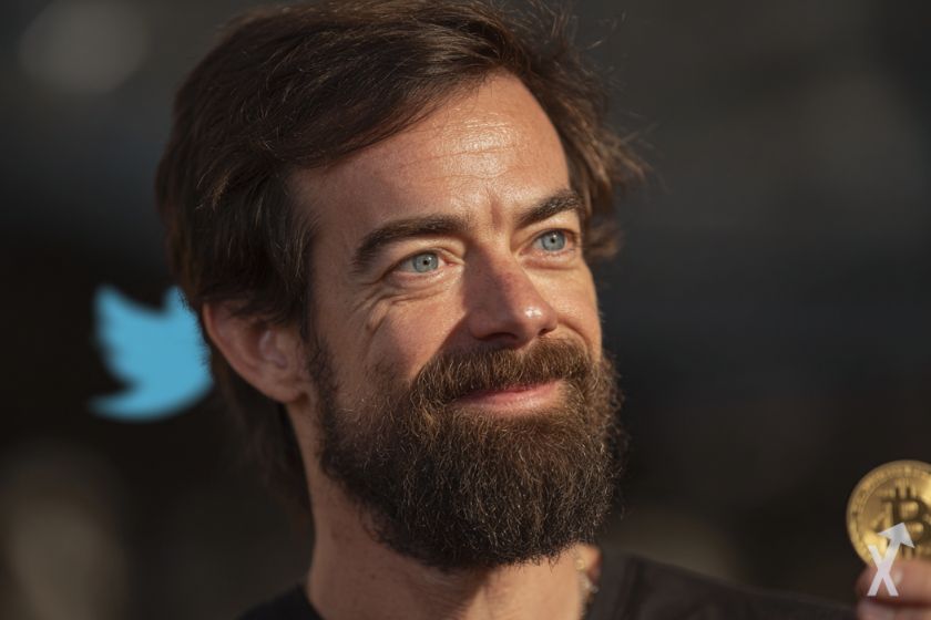"Smiling Jack Dorsey with a bitcoin"