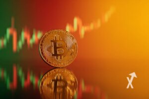 Bitcoin coin on orange background with candlestick trendline graph.
